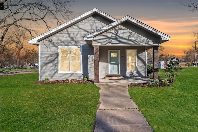 bungalow-style house featuring a front lawn and a porch