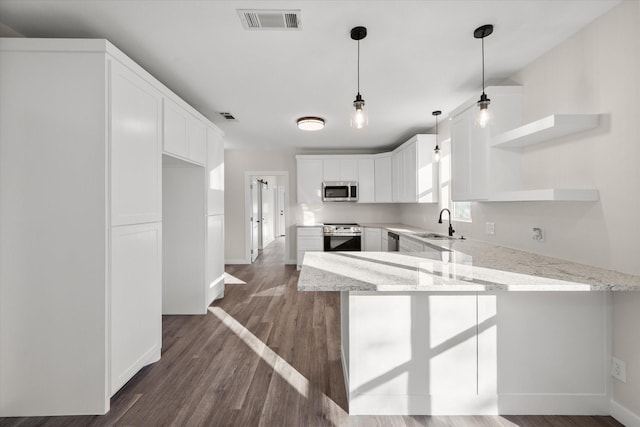 kitchen with open shelves, appliances with stainless steel finishes, a peninsula, white cabinets, and dark wood-style flooring