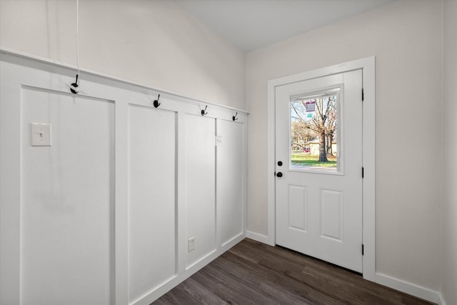 entryway featuring baseboards and dark wood-style floors