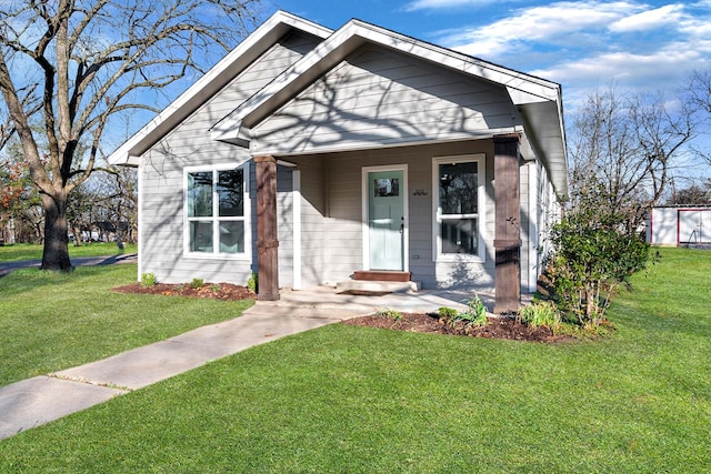 bungalow-style home featuring a front yard