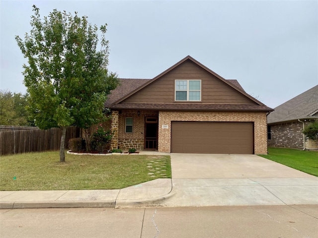 210 Donna Cir, Granbury, TX 76049 - view of front facade featuring brick siding, a front lawn, and fence