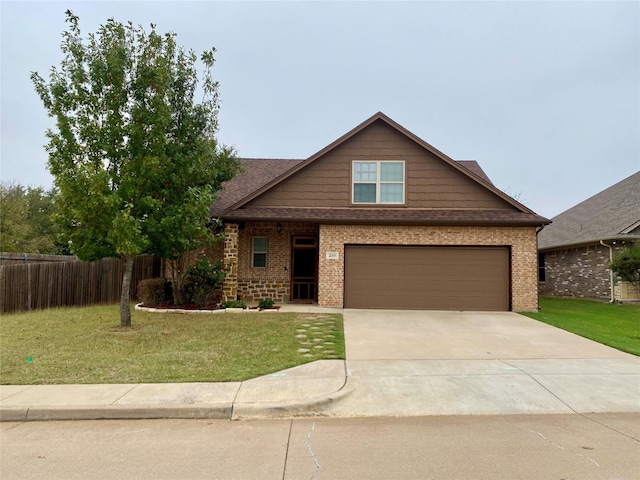 view of front facade featuring brick siding, a front lawn, and fence