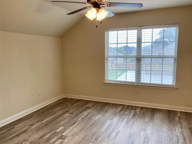 bonus room featuring wood finished floors, a healthy amount of sunlight, and baseboards