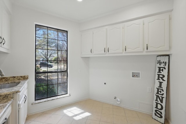 laundry room with baseboards, cabinet space, electric dryer hookup, washer hookup, and a sink