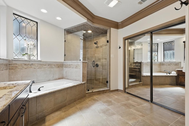 full bath featuring a wealth of natural light, a shower stall, crown molding, a bath, and vanity