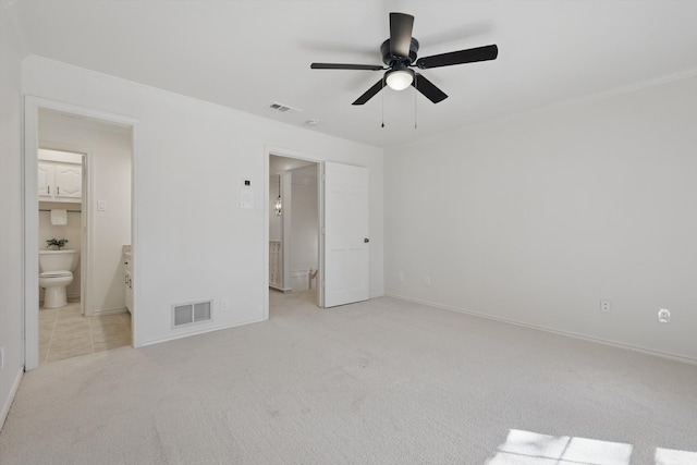 unfurnished bedroom with carpet, visible vents, ensuite bathroom, and baseboards