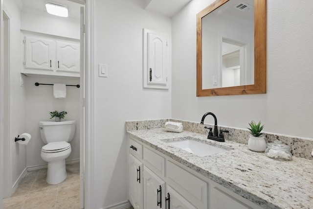 bathroom with visible vents, baseboards, toilet, tile patterned floors, and vanity