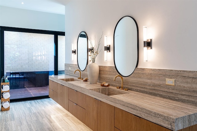 bathroom featuring double vanity and a sink