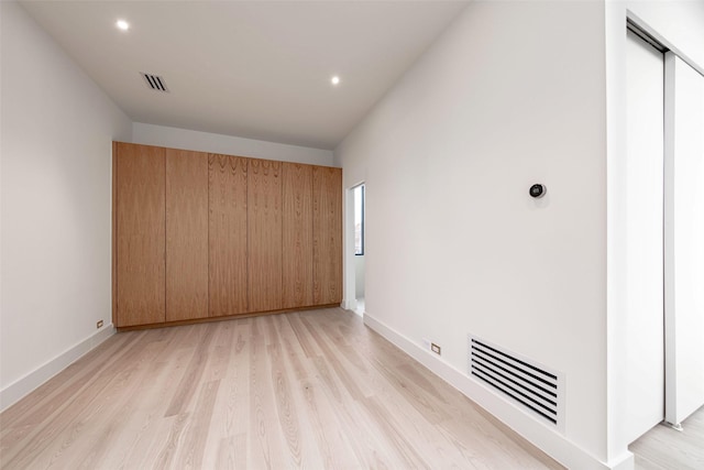 unfurnished bedroom with recessed lighting, visible vents, baseboards, and light wood-style flooring