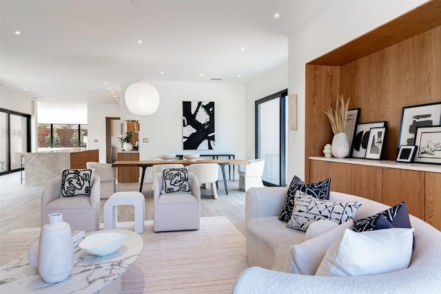 living room featuring light wood finished floors and recessed lighting