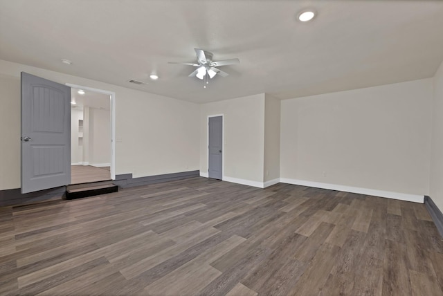 spare room with visible vents, a ceiling fan, wood finished floors, recessed lighting, and baseboards