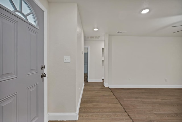 foyer with visible vents, recessed lighting, baseboards, and wood finished floors