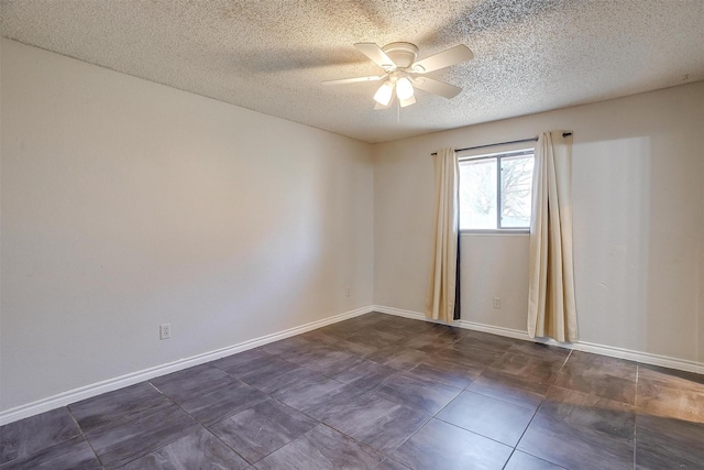 unfurnished room featuring baseboards, a textured ceiling, and a ceiling fan