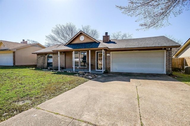 single story home with a front yard, driveway, a chimney, a garage, and brick siding