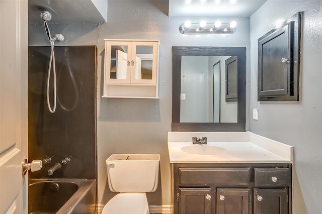 bathroom featuring bathing tub / shower combination, toilet, and vanity