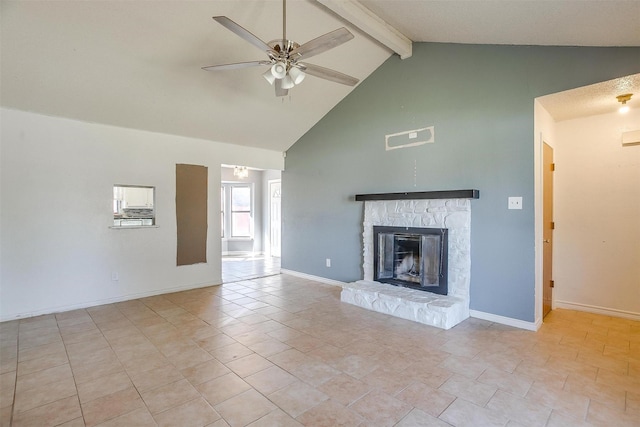 unfurnished living room with beamed ceiling, visible vents, a stone fireplace, baseboards, and ceiling fan