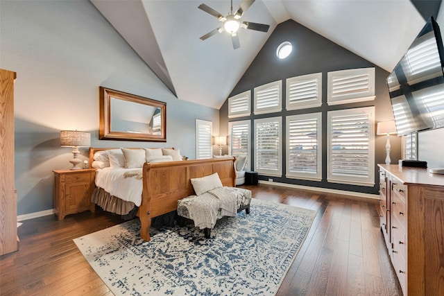 bedroom featuring ceiling fan, high vaulted ceiling, dark wood-type flooring, and baseboards