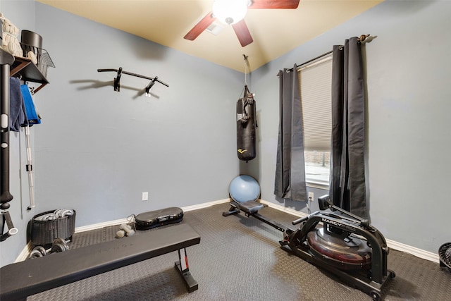 exercise area featuring baseboards and ceiling fan