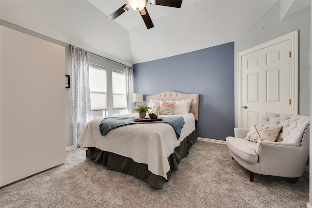 carpeted bedroom with baseboards, a ceiling fan, and vaulted ceiling