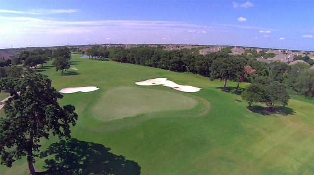 birds eye view of property with view of golf course