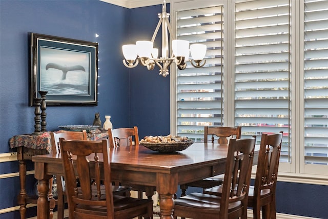 dining area featuring a notable chandelier