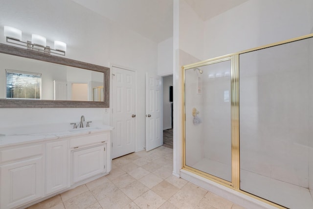 full bathroom featuring vanity and a shower stall