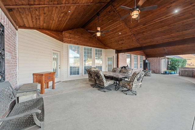 view of patio featuring outdoor dining area and a ceiling fan