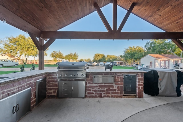 view of patio with a gazebo, a grill, and exterior kitchen