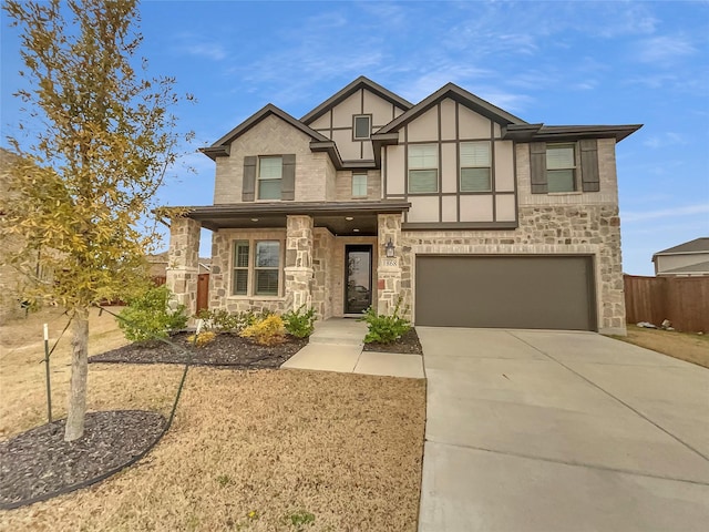 view of front facade featuring stone siding, stucco siding, an attached garage, and concrete driveway