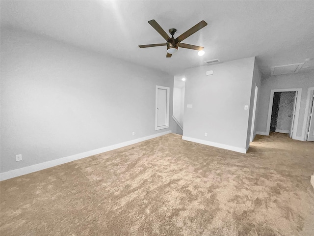 unfurnished room featuring visible vents, ceiling fan, carpet, and baseboards