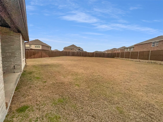 view of yard with a fenced backyard