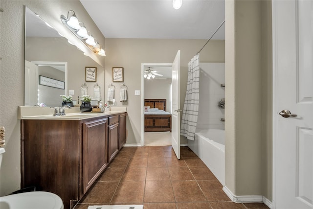 4011 Ridgetop Dr, Heartland, TX 75126 - full bathroom featuring double vanity, a sink, tile patterned flooring, ceiling fan, and shower / tub combo