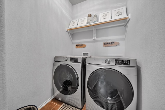 4011 Ridgetop Dr, Heartland, TX 75126 - clothes washing area with a textured wall, independent washer and dryer, laundry area, and tile patterned flooring