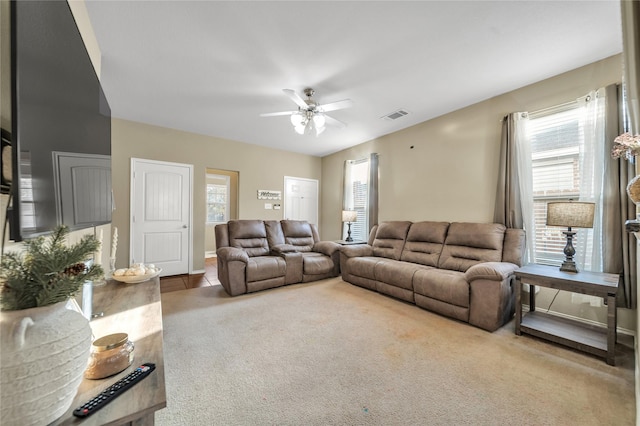 4011 Ridgetop Dr, Heartland, TX 75126 - carpeted living area featuring a wealth of natural light, visible vents, baseboards, and ceiling fan