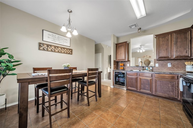 4011 Ridgetop Dr, Heartland, TX 75126 - kitchen featuring beverage cooler, visible vents, tasteful backsplash, and a sink