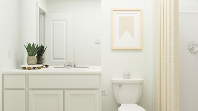 full bathroom featuring vanity and toilet