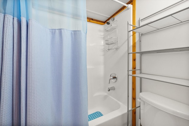 bathroom with shower / bath combination with curtain and toilet