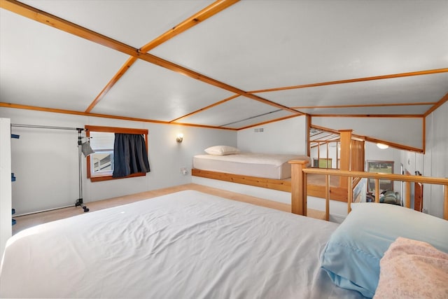 bedroom featuring lofted ceiling and carpet floors