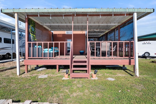 wooden deck with a lawn