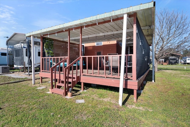 2092 Pelican Isle Dr, Kerens, TX 75144 - rear view of house featuring a yard, a deck, and a carport
