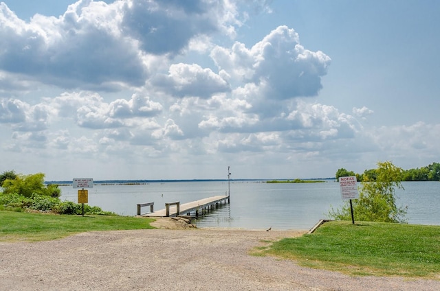 dock area with a water view