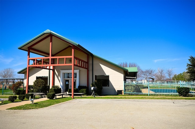 view of building exterior featuring fence