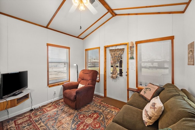 living area featuring visible vents, baseboards, a ceiling fan, and vaulted ceiling with beams