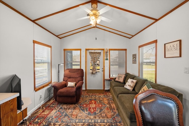 living room with crown molding, ceiling fan, and vaulted ceiling