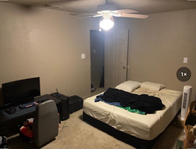 bedroom featuring ceiling fan and light carpet