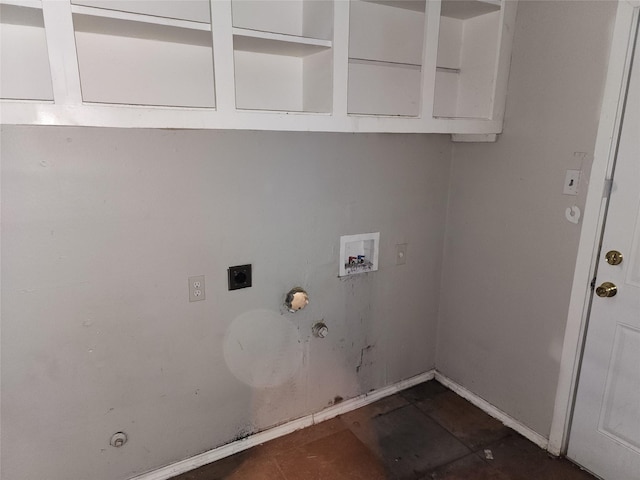 clothes washing area featuring cabinet space, electric dryer hookup, washer hookup, and hookup for a gas dryer