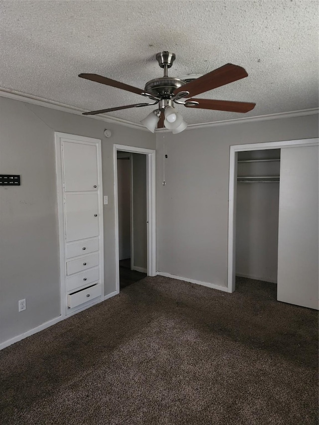 unfurnished bedroom with baseboards, a textured ceiling, a ceiling fan, and carpet floors