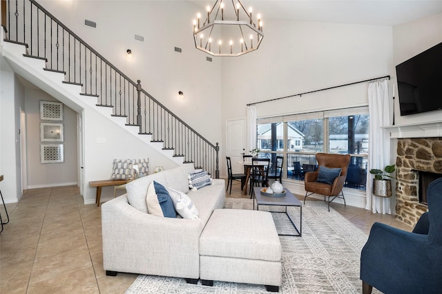 156 Palisade Dr, Gun Barrel City, TX 75156 - living room featuring light tile patterned flooring, a fireplace, baseboards, a chandelier, and stairs
