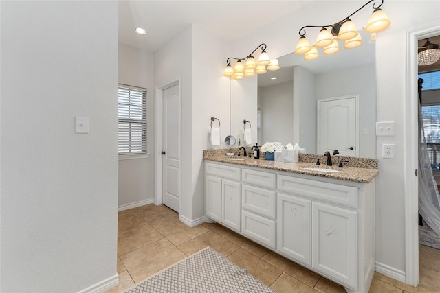 156 Palisade Dr, Gun Barrel City, TX 75156 - bathroom with double vanity, baseboards, and a sink