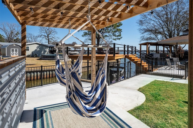 156 Palisade Dr, Gun Barrel City, TX 75156 - view of patio with an outbuilding, a pergola, a storage shed, and fence